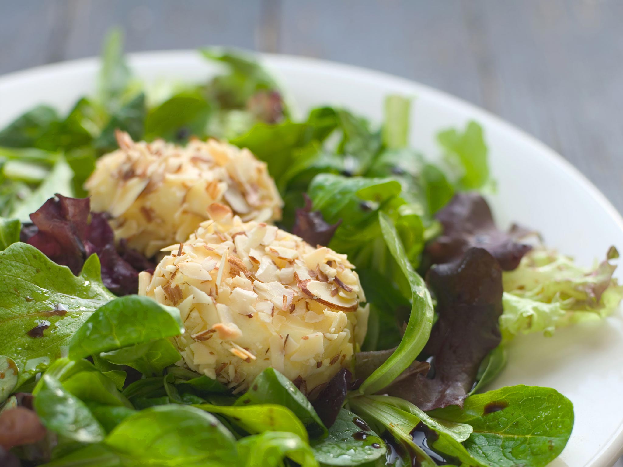Recipe AlmondCrusted Goat Cheese over Mixed Greens Whole Foods Market